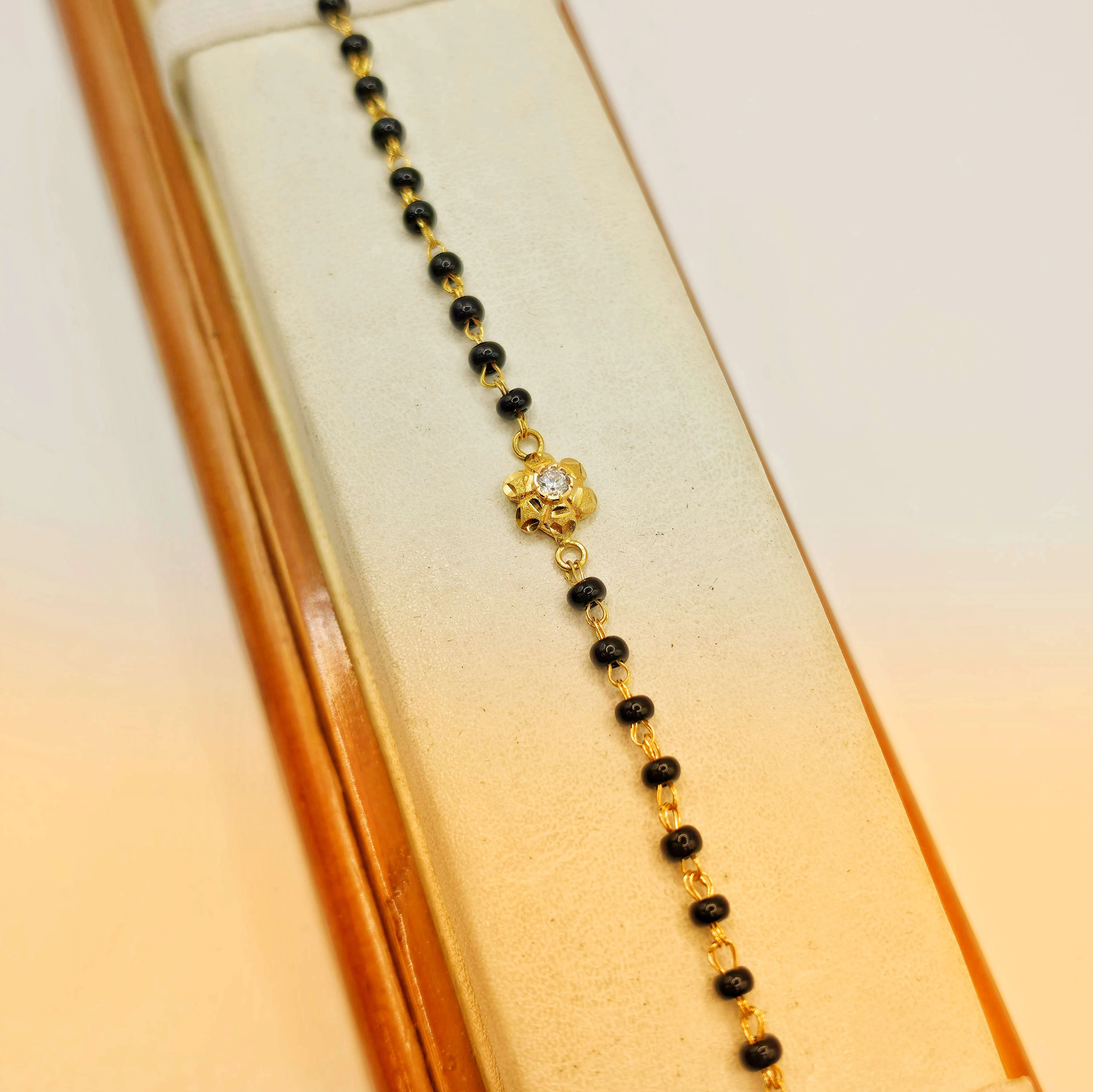 CHARMING GOLD FLORAL AMERICAN DIAMOND MANGALSUTRA BRACELET